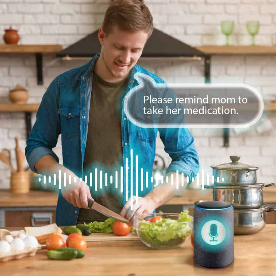 Man speaking to voice recognition device while cooking