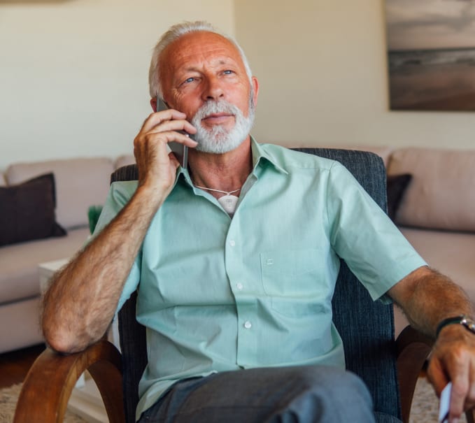 mature man talking on cell phone